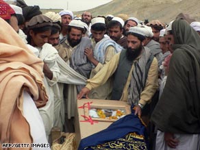 Tribesmen mourn a suspected U.S. airstrike victim in northwest Pakistan, scene of suicide attacks and airstrikes.