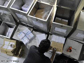 A poll worker prepares ballot boxes in Jakarta on Wednesday on the eve of the parliamentary elections.