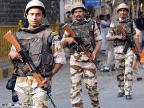 Soldiers patrol in Mumbai on the eve of the trial of a key suspect in last year's attacks in the Indian city.