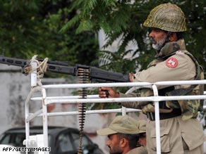 Taliban representatives leave talks in Peshawar in February after reaching a deal on Sharia law in Swat.