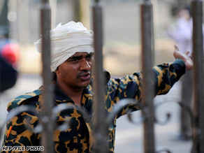 A Bangladesh Rifles soldier is shown wearing a white cloth signifying surrender in late February.