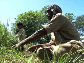 Mohammed Daoud, with his son Faisal, is among those who have embraced the Taliban's message.