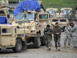 U.S. Army soldiers, right, watch two Afghan soldiers at ISAF's Camp Bostick in Naray, in the eastern Kunar province.