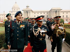 General Rookmangud Katawal gestures after inspecting the guard of honour in New Delhi on December 12, 2007.