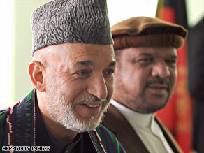 Afghan President Hamid Karzai appears with running mate Mohamed Fahim, a former warlord.