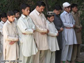 A moment of prayer and reflection for the orphans and one of their teachers.