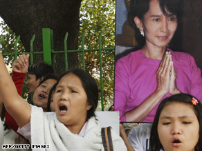 Pro-democracy supporters hold a portrait of Aung San Suu Kyi in New Delhi, India.