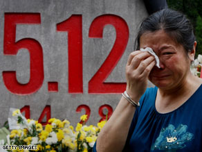 A relative of victims of last year's earthquake mourns in Beichuan County, China.