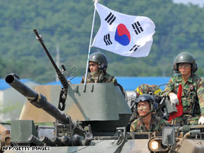 South Korean soldiers ride in armored vehicles during a drill Friday in the border city of Paju.