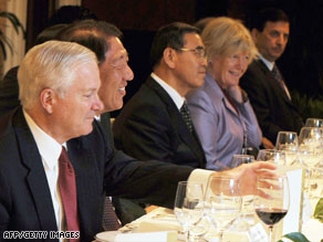 Defense Secretary Robert Gates, left, meets with other world leaders at a conference Saturday in Singapore.