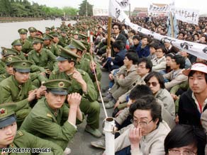 Students face police in Tiananmen Square at a funeral ceremony for liberal reformer Hu Yaobang, 22 April 1989.