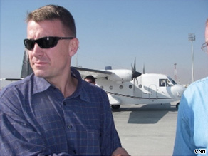 Erik Prince (center, in brown jacket) speaks to some of his contractors in Kabul, Afghanistan, in November 2007.