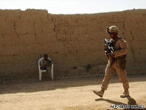 A U.S. Marine patrols Garmser district in Afghanistan's Helmand province on Friday.