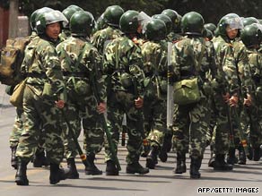 Chinese riot police patrol a street in Urumqi in Xinjiang province on July 6.