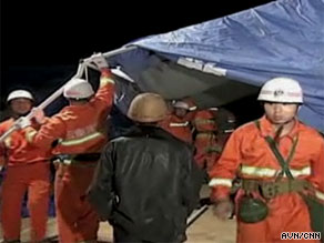 Rescue workers attend to the scene of the earthquake which hit southwest China on Thursday.