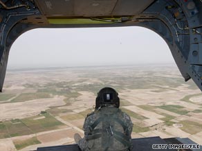 A soldier mans a weapon at the rear of a U.S. Army helicopter over Afghanistan in May.