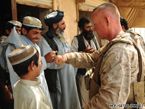 Brig. Gen. Larry Nicholson greets a Helmand resident on July 3.