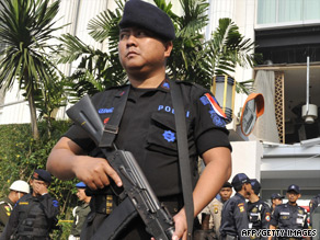Indonesian counter-terrorist police commandos secure the damaged Ritz-Carlton hotel in Jakarta.