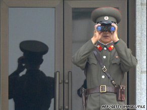 A North Korean soldier looks at the South Korean side of the demilitarized zone earlier this month.