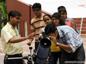 People test the "sky watching telescope" at the Gujarat Council of Science City in India.