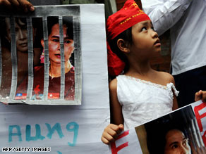 A young girl holds a portrait of Aung San Suu Kyi at a rally in Bangkok, Thailand, on Tuesday.