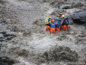 Rescuers brave raging torrents to pull survivors from mudslides in Taiwan.