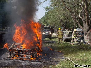 A car burns after the suicide blast outside NATO's Afghanistan headquarters during the weekend.