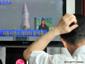 A television screen in a Seoul rail station showing a broadcast on the suspended rocket launch.