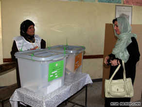 Afghan first lady Zenat Karzai votes for her husband and provincial council candidates in Kabul.