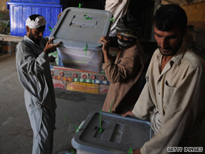 Election workers unload ballot boxes Sunday at the Independent Election Commission headquarters in Kabul.