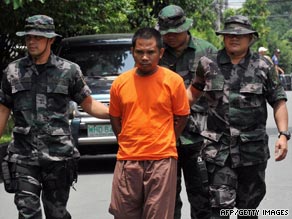 Police escort Hajer Sailani at the Philippine National Police headquarters on September 1, 2009