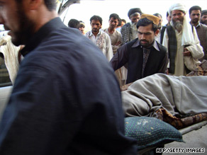 A victim of an ISAF airstrike on a hijacked oil tanker is carried into the Kunduz hospital on Friday.