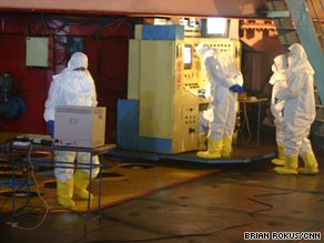 Workers remove fuel rods from the Yongbyon nuclear reactor in North Korea in February 2008.