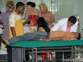 An doctor in Bali, Indonesia, treats a man injured during the earthquake on Saturday.