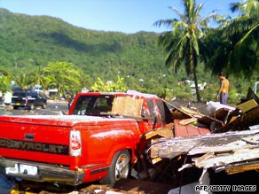 Debris clutters a road in Pago Pago, American Samoa, after a devastating earthquake and tsunami last month.