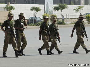 Soldiers march at army HQ in Rawalpindi Tuesday, three days after militants took dozens of hostages in a siege.
