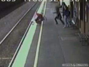 The stroller rolling towards the edge of the platform.