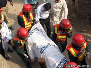 Pakistani authorities remove bodies from the scene of Thursday's deadly attacks in Lahore.