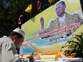 A well-wisher signs a get well petition for Thailand's King Bhumibol Adulyadej.