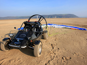 The Skycar's fabric wing is folded and packed in the back of the car when driving on the road.