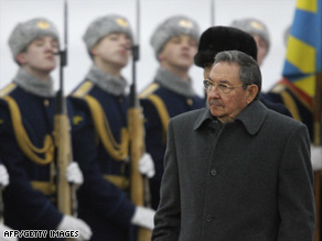 Cuban President Raul Castro reviews honor guards after arriving Wednesday in Moscow, Russia.