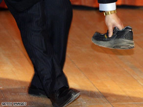 Protester throws shoe at China's premier