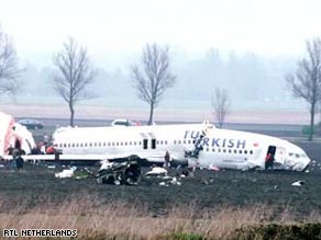 Images from the scene of the Amsterdam crash show the plane broken into three pieces.