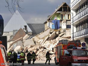 Rescuers are searching for people trapped under the building in Cologne, Germany.