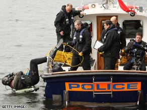 Police divers carry out security checks near the site of next week's G-20 summit in London.