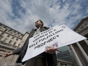 A protester addresses city workers outside the Bank of England in London on Tuesday.