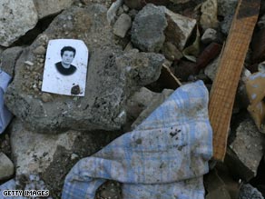 A photo lies in the rubble at Onna, near L'Aquila.