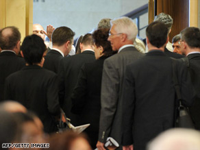 Swiss President Hans-Rudolf Merz, left, greets Ahmadinejad after his arrival in Switzerland.