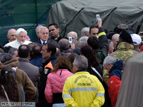 Pope Benedict XVI speaks to quake survivors at a tented camp in the village of Onna.