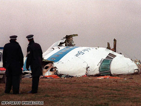 Police officers survey the wreckage of Pan Am Flight 103 in December 1988.